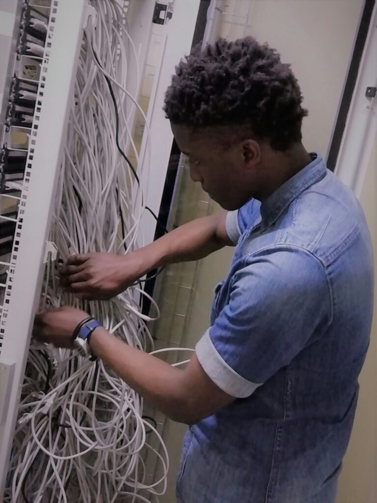 Technician organizing network cabling